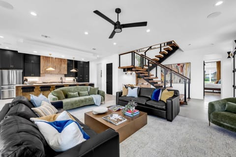 Living area with an abundance of seating options, lake view, and Smart TV