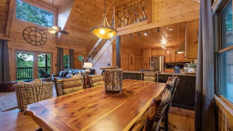 Dine and relax in style—vaulted ceilings, rustic charm & forest-view deck!