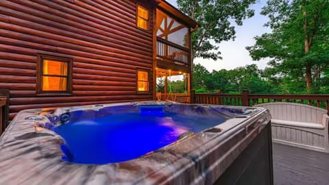 Unwind in a private hot tub under the stars—your perfect mountain cabin escape!