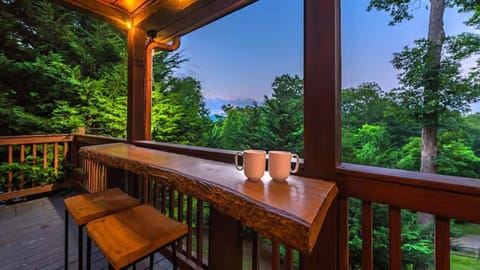 Sip & relax at the live-edge bar—perfect for peaceful mornings or sunset views!