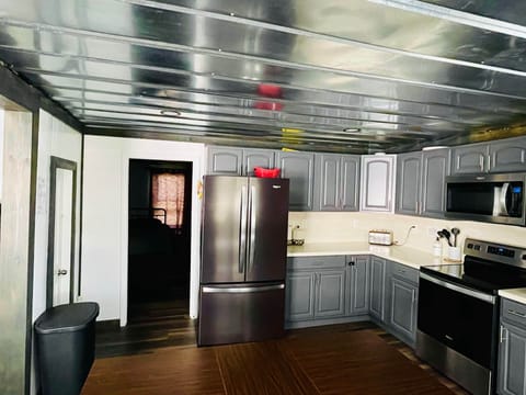 Kitchen leading into 3 bedroom 