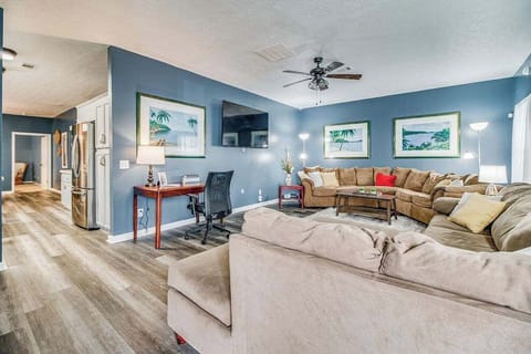 Living room with a large sofa and a smart TV 