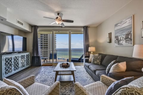 Living room with sleeper sofa and balcony access