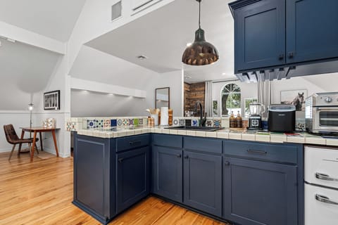 The countertop comes fully equipped and ready—everything you need for quick meals, drinks, and snacks at Wimberley Treehouse.