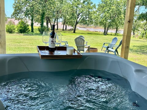 Unwind in your private hot tub with a glass of wine and the serene sounds of the lake