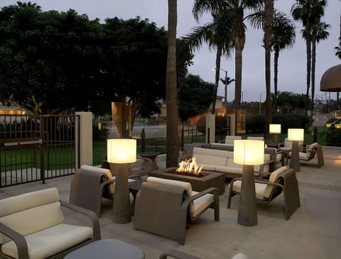 Toast the night with glowing bar lights and elegant seating.