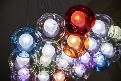 Feel the boutique vibe under artful lighting and glossy finishes.