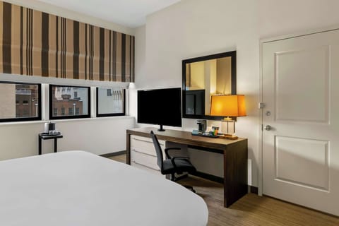 Start your morning with coffee by the window and city views.