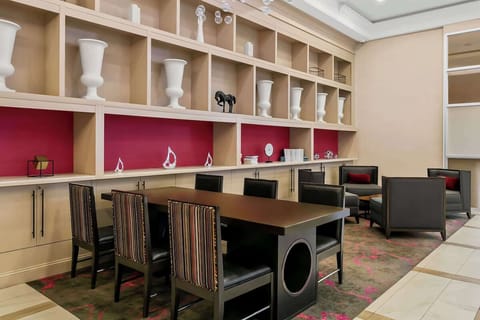 Gather and linger in stylish seating beside curated built-in shelving.