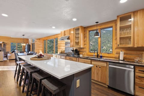 The dining room flows into the spacious kitchen, which has an additional six barstools at the counter.