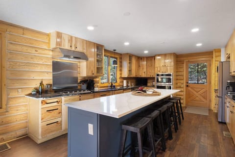 The kitchen is fully equipped with everything you need to cook a meal including dishes, cookware, utensils, plates, cups & bowls.