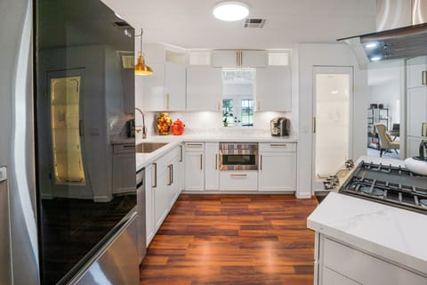 Modern kitchen with stainless appliances and generous counter space