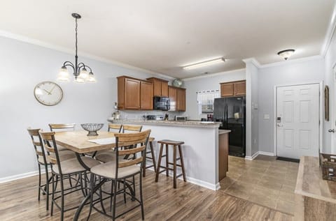 Seating for six at the dining table with additional seating at the breakfast bar