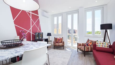 Bright living space featuring stylish red accents and a modern dining area.
#InteriorGoals #BrightSpaces #LovelyStay