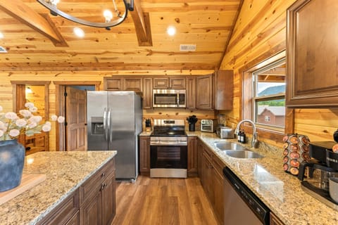 Modern kitchen with stainless steel appliances and all the essentials for home cooked meals.