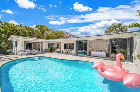 Just imagine stepping out of your room right into this!  We love this sparkling pool because it feels like a private resort just for you. With those huge doors that disappear, the line between indoor comfort and tropical sun is gone.