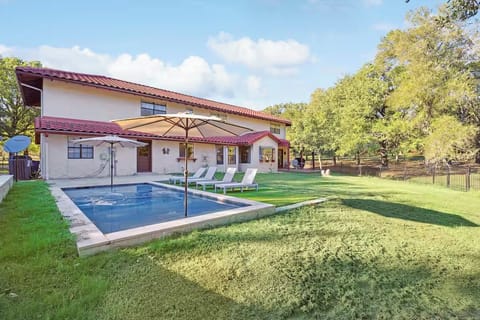 Go swimming in the pool with sun loungers and umbrellas.