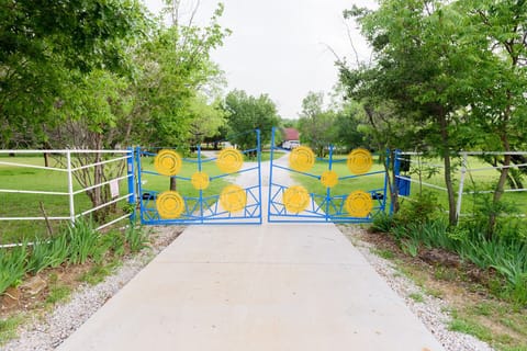 The property features a gated front entrance.