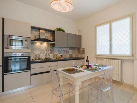 Furniture, Interior Design, Flooring, Kitchen, Countertop, Wood, Light Fixture, Ceiling, Floor, Major Appliance