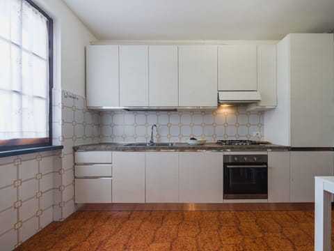 Kitchen, Flooring, Countertop, Interior Design, Kitchen Appliance, Wood, Major Appliance, Kitchen Stove, Cabinetry, Floor