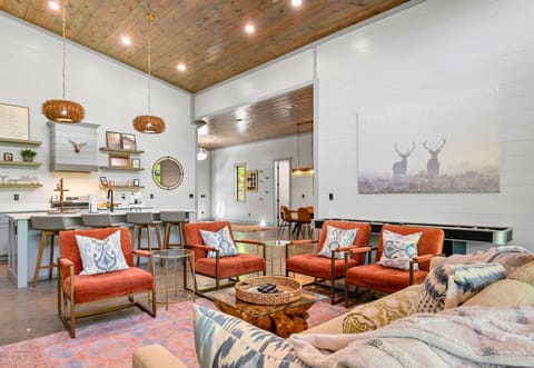 Spend quality time with loved ones in this open-concept living area, featuring plush seating, elegant décor, and a state-of-the-art entertainment system.