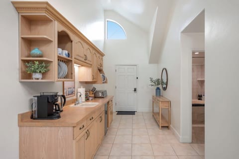 Well-equipped kitchen with coffee maker, microwave, toaster, and mini fridge