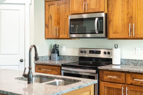 Cook up your favorite meals with ease in the well-stocked kitchen