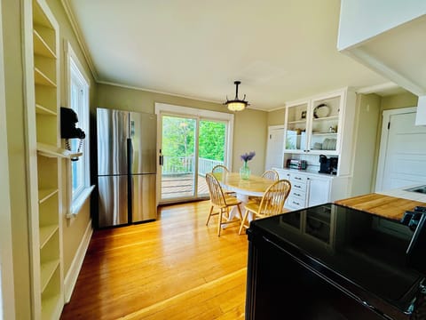 Fully equipped kitchen with sliding door access to the deck.