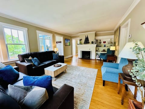 Spacious, bright living room with a decorative fireplace