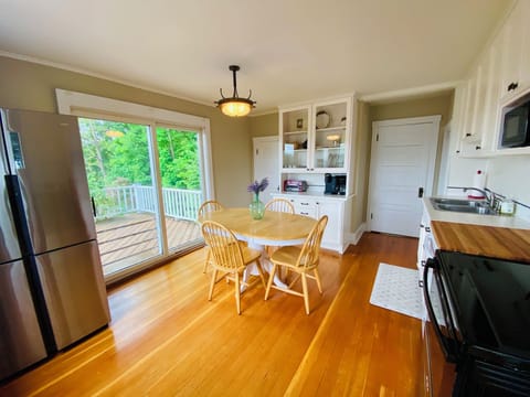 Spacious, updated kitchen with access to the deck.
