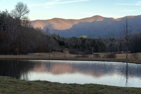 Reflecting on the stillness, where water meets mountain light.