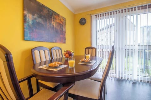 Dining area with a comfortable table and seating, perfect for enjoying meals, casual dining, or working during your stay.