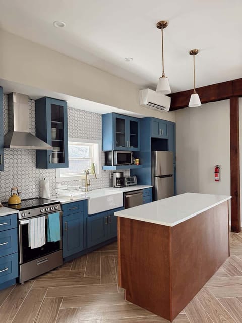 Second Floor: Fully renovated kitchen with brand new appliances (Coffee, powdered creamer, sugar, salt & pepper, spices and oil provided) Mini split providing heat/AC, provides control for the entire open space.