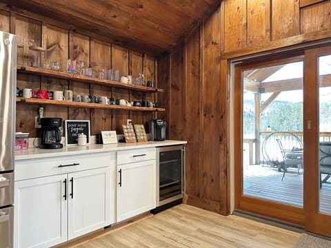Cozy coffee station with Keurig, drip coffee & mugs for relaxed mornings.