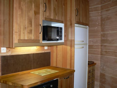 Ample countertops with refrigerators and microwaves