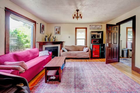 Living room with fully stocked coffee bar and fireplace. 