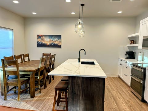 modern living room offers comfy seating, cozy fireplace, and a SmartTV