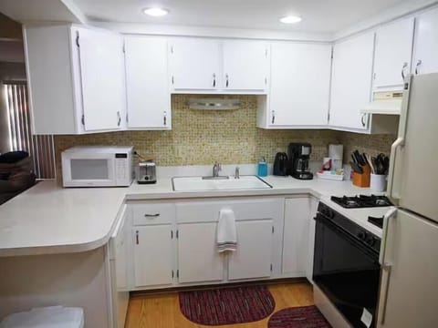 Full kitchen has all the amenities you need for a comfortable stay.