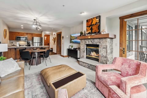 Living room: Pull-out sofa, gas fireplace, Smart TV, balcony access