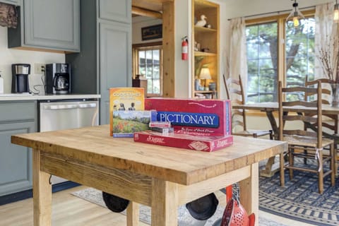 Gather around the kitchen island for a night of classic games and connection—perfect for cozy evenings in the mountains.








