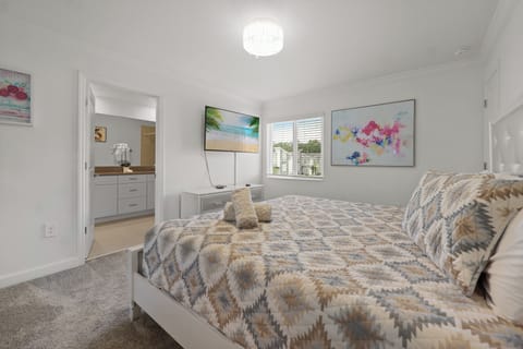 Relax in this spacious master suite featuring a king-size bed and private bath, your own peaceful retreat.