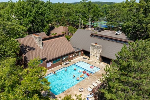 Dive into fun at The Knolls` outdoor pool! Perfect for cooling off during your Lake of the Ozarks getaway at Knoll Worries.
