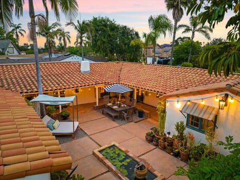 Evenings come alive by the yellow fireplace and tranquil fountain in this magical outdoor lounge.