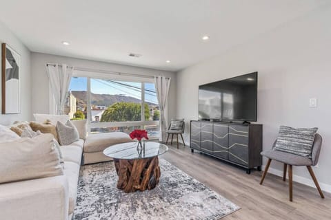 Relax with your family while watching Netflix from this large flat screen TV