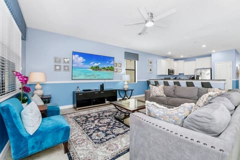 Kick back in your private cinema-style room—perfect for movie nights with cozy seating and a big-screen experience!