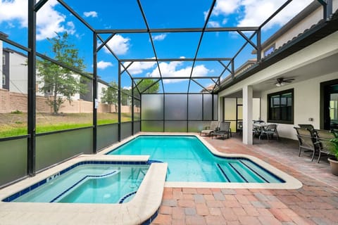 Enjoy your private screened-in pool and bubbling hot tub—ideal for a refreshing dip or a relaxing soak.