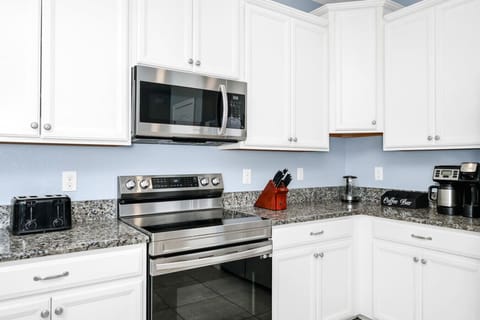 Cook with ease in the fully equipped kitchen—complete with modern appliances, cookware, and plenty of space.