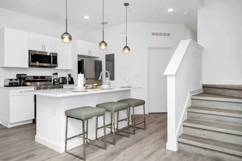 Modern kitchen stocked with all the essentials, ready for home-cooked meals.