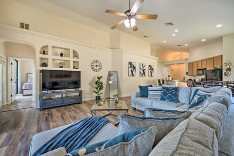 Relax in a spacious living room with plush seating and a smart TV for all your entertainment needs.