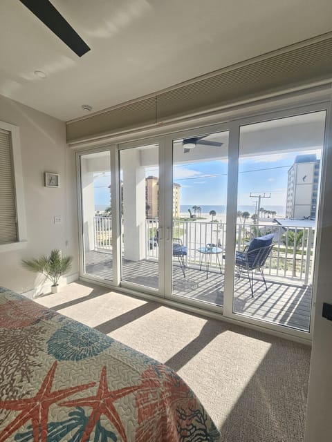 Outdoor seating area offering a relaxing seaside experience in-suite.